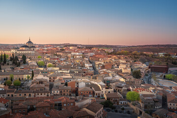 Fototapeta na wymiar Toledo Skyline at sunset with Hospital Tavera - Toledo, Spain