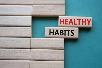 Healthy habits symbol. Concept word Healthy habits on wooden blocks. Beautiful grey green background. Business and Healthy habits concept. Copy space