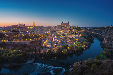 Fototapeta na wymiar Toledo Skyline with Cathedral, Alcazar and Tagus River at night - Toledo, Spain