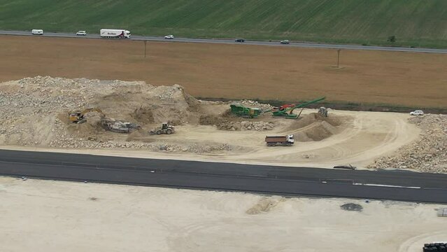  D7 motorway is a highway northwest from Prague to Chomutov and the German border,building of new highway by Louny city,speed road construction work with bridges and modern infrastructure,Czech-Europe