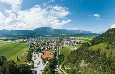 Fototapeta na wymiar Aerial View of the small Town Kundl in the Region of Tyrol, Austria, overlooking the Inntal Valley during Summer.
