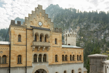 Fototapeta premium stone castle backed by rocky mountains