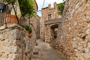 Stone houses and bell tower of the village Velo Grablje on Island Hvar in Croatia, founded in the...