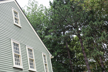 suburban house stands empty, its foreclosure sign reflecting the financial recession and housing market crash, symbolizing the burden of mortgage rates
