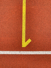 running track with yellow number one and white stripe, no person, vertical format