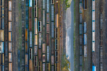 Aerial view of rusty freight trains at the railway station.