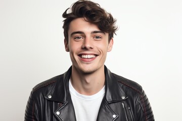 Portrait of a smiling young man in a leather jacket on a white background