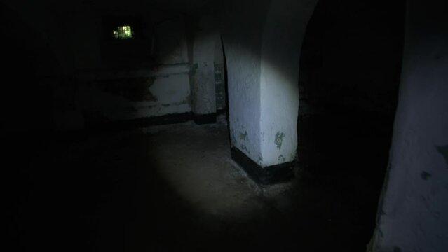 Man finding ghost lying on altar in basement of abandoned asylum. POV shot