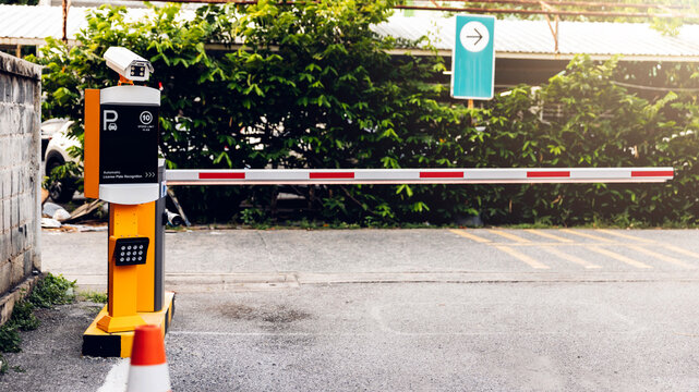 Car park automatic entry system. Security system for building access - barrier gate stop with toll booth, Security CCTV camera