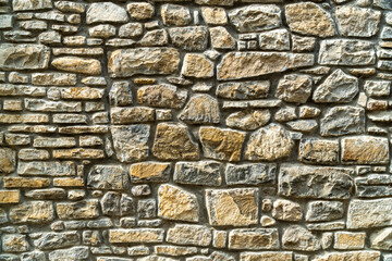 Rustic stone wall of a village house