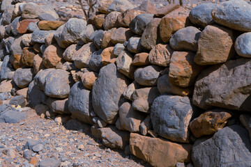 Man made stacked rock wall.
