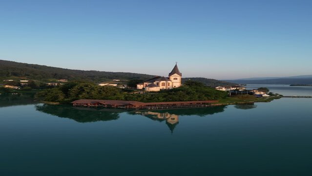 Woerthersee Lake in Carinthia Austria with Church of Maria Worth - Aerial Drone Footage