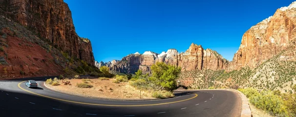 Tuinposter Desert Serenity: Panoramic View of an Empty Road Surrounded by Red Rock Canyon After a Storm, Presented in Captivating 4K Resolution © Only 4K Ultra HD