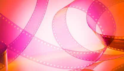 abstract colored cinematic background with film strip.background banner for film premiere festivals production.