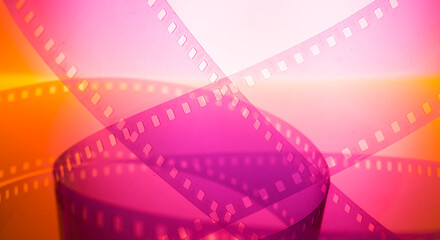 abstract colored cinematic background with film strip.background banner for film premiere festivals...