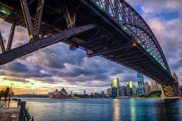 Fototapeta premium The harbor bride framing the skyline of Sydney Australia with the famous Opera House