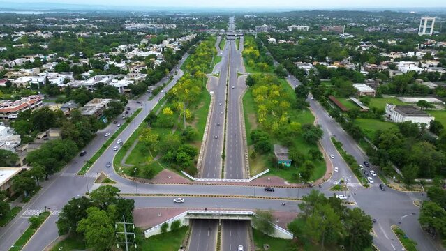 Buzzing Streets: Aerial 4K Video Showcasing Traffic at Islamabad City Center Crossroad, Beautiful panoramic aerial video from flying drone to Islamabad city center
