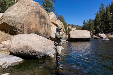 Man casting for fish in Cheesman canyon, Colorado