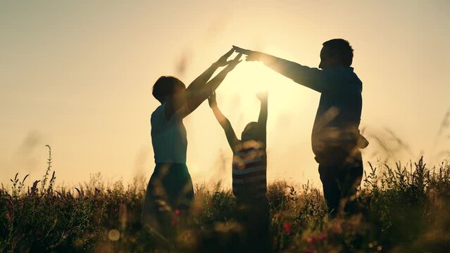 silhouette roof house. buy family home. house symbol. apartment dream sign. roof house. mother father child happy family sunset. holding hands family silhouette. epoteka loan purchase residential