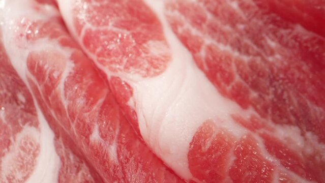 Raw Pork Neck Slice, The Camera Can Zoom In On The Glistening Moisture On The Surface Of The Meat, Further Emphasizing Its Freshness And Tenderness. Showcasing Its Softness And Malleability. 4K
