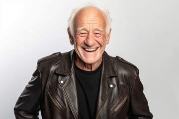 man in his 90s that is wearing a trendy faux leather jacket against a white background