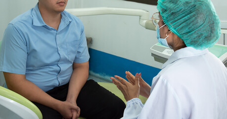 Dentists explains to the patient in dental clinics, dental care consultations.