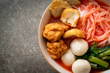 small flat rice noodles with fish balls and shrimp balls in pink soup, Yen Ta Four or Yen Ta Fo