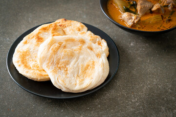 Chicken curry soup with roti