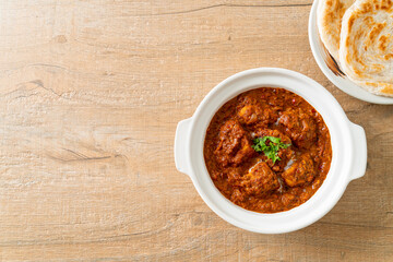 chicken tikka masala spicy curry meat food with roti or naan bread