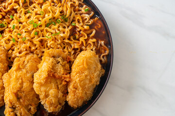 Korean instant noodles with fried chicken or Fried chicken ramyeon