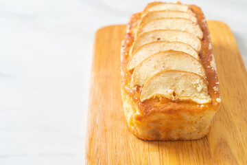 apple loaf crumbled on wood board
