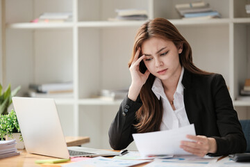 Business women are stressed while working on laptop, Tired asian businesswoman with headache at office, feeling sick at work, copy space