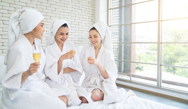 asian female drinking wine at bedroom