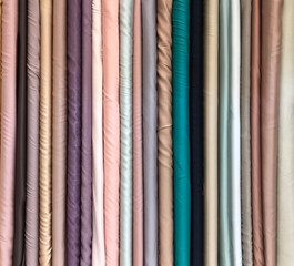 Collection of Neatly Arranged Colorful Fabrics for Shop Display. legged mammal