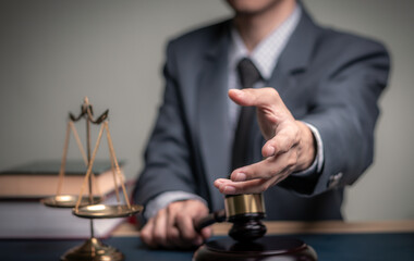 Lawyer's hand concept Justice with Judge gavel, Businessman in suit or Hiring lawyers in the digital system. Legal law, prosecution, legal adviser, lawsuit, detective, investigation,legal consultant.