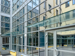 business office building with glass facade. glass wall with reflections.