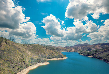 Mountain landscape in early spring. View of a mountain valley with a river. View of Zezere river from the bridge. Ferreira do Zezere, Portugal