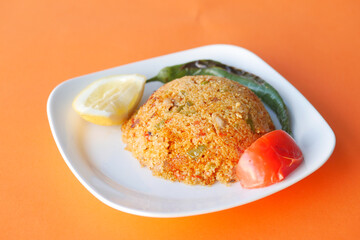bulgur rice with tomato on a plate ,