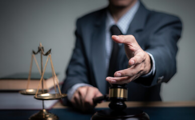 Fototapeta na wymiar Lawyer's hand concept Justice with Judge gavel, Businessman in suit or Hiring lawyers in the digital system. Legal law, prosecution, legal adviser, lawsuit, detective, investigation,legal consultant.