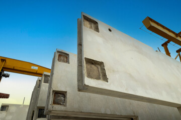 Prefabricated concrete walls for building office buildings and residential houses. Precast reinforced concrete wall panel for construction building.