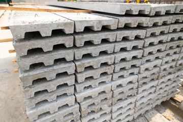 Stack of Prefabricated concrete slabs for building office buildings and residential houses. Precast reinforced concrete wall panel for construction building.