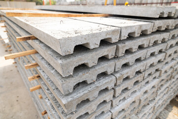 Stack of Prefabricated concrete slabs for building office buildings and residential houses. Precast reinforced concrete wall panel for construction building.