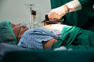 Professional ICU doctor CPR helps to defibrillate for life safety, critically and coma-ill patients...
