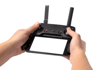 droning remote controller in hands, isolated on transparent background, with phone and place for text