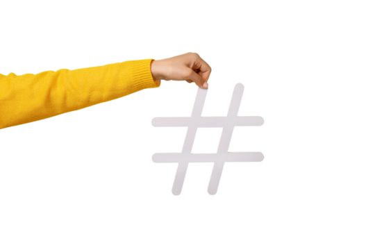 Social media concept, female hand holding big white hashtag sign isolated on transparent background