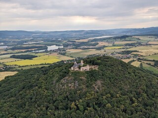 Aerial panorama of Doubravska Hora Castle near Teplice, showcasing its hilltop location, historical significance, and scenic views of the Czech landscape