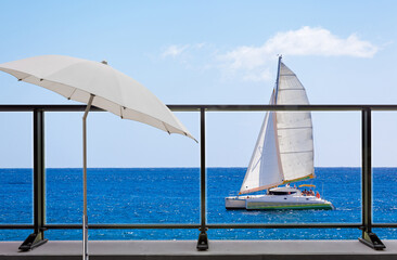 terrasse avec vue sur catamaran en mer  - obrazy, fototapety, plakaty