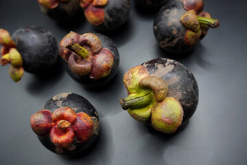 Mangosteen, Mangosteen group on black background, white meat