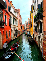 Gondola ride in Venice surrounding with colorful building architecture