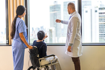 Obraz premium Man doctor with stethoscope service help support discussing and consulting care talk to sick senior asian woman patient in hospital,caregiver,elderly,recovery,illness insurance.healthcare and medicine